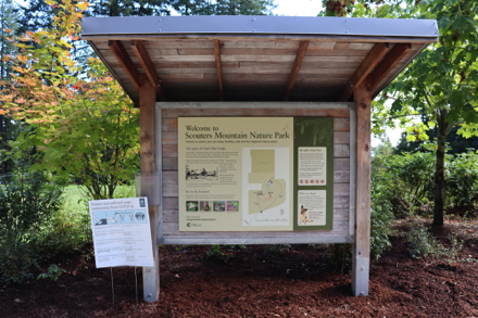 Informational kiosk with park map at main (upper) parking lot, shelter and restrooms